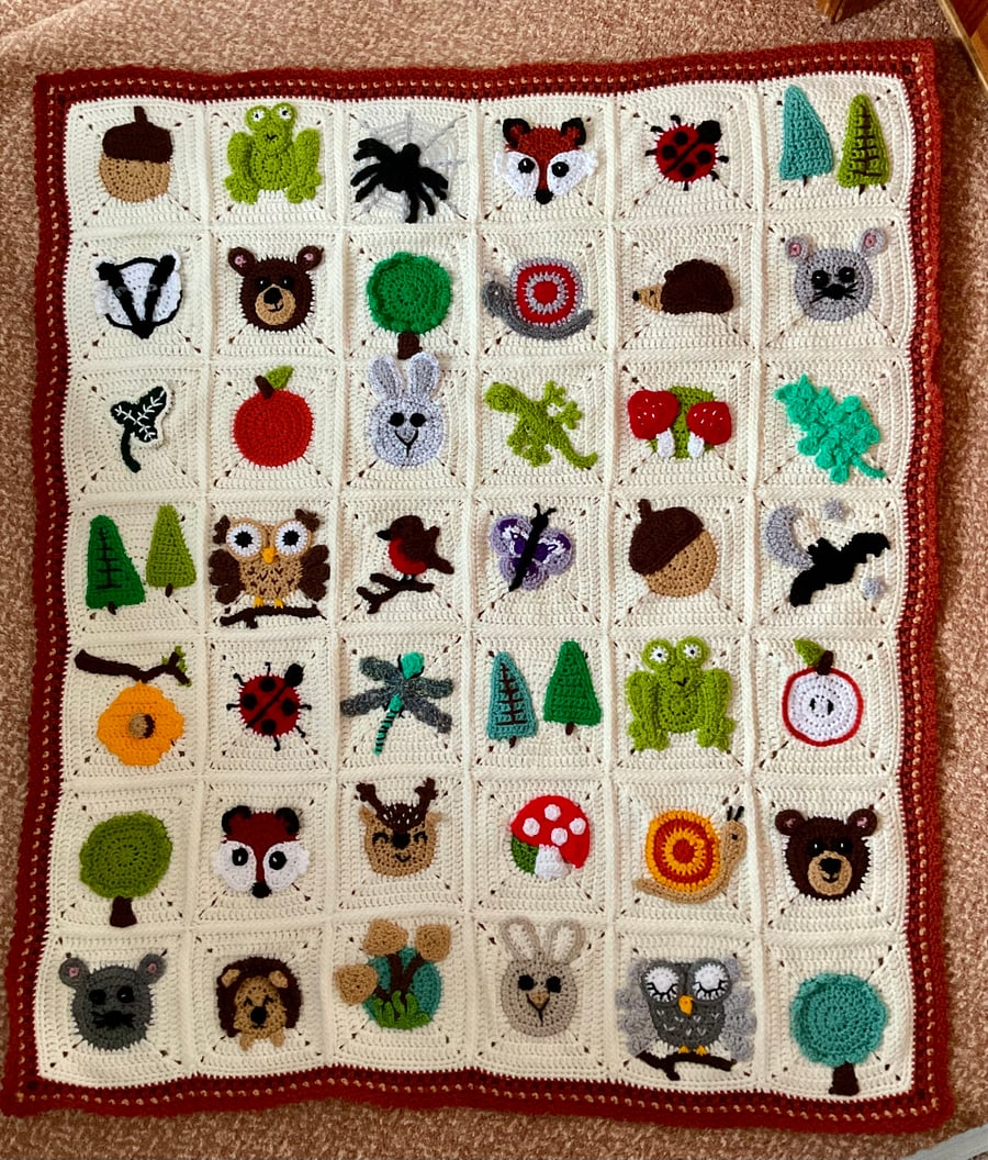 Crocheted crochet baby or child’s blanket animal woodland theme.
