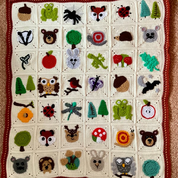 Crocheted crochet baby or child’s blanket animal woodland theme.