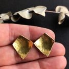 Brass and sterling silver stud earring.