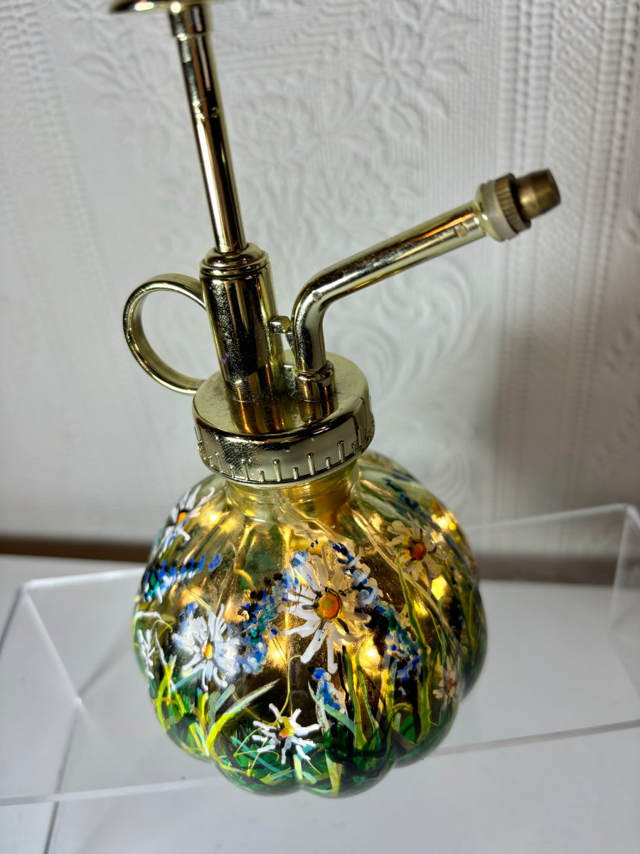 A hand painted and fired glass plant spray mister