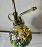 A hand painted and fired glass plant spray mister