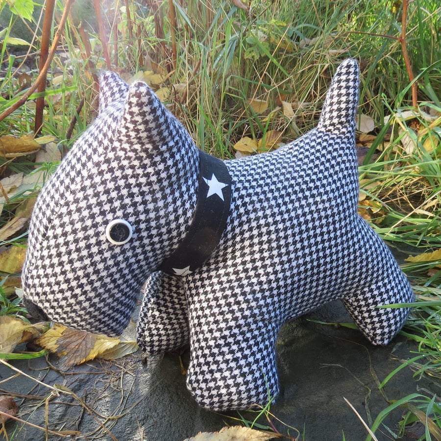 Dog Doorstop.  A scottie dog doorstop, made from a soft wool.