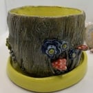 Decorated plant pot including saucer