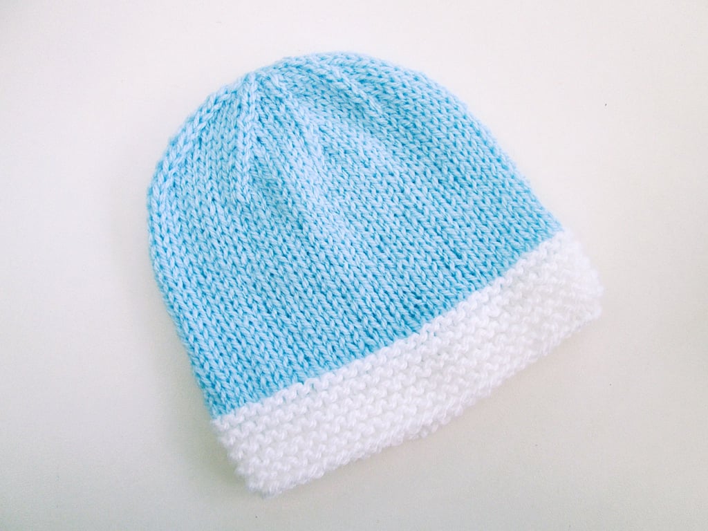 Hand knitted baby hat in blue and white, 100% acrylic, new baby gift