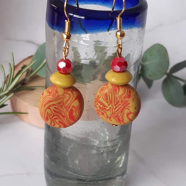 Mustard and red dangly earrings