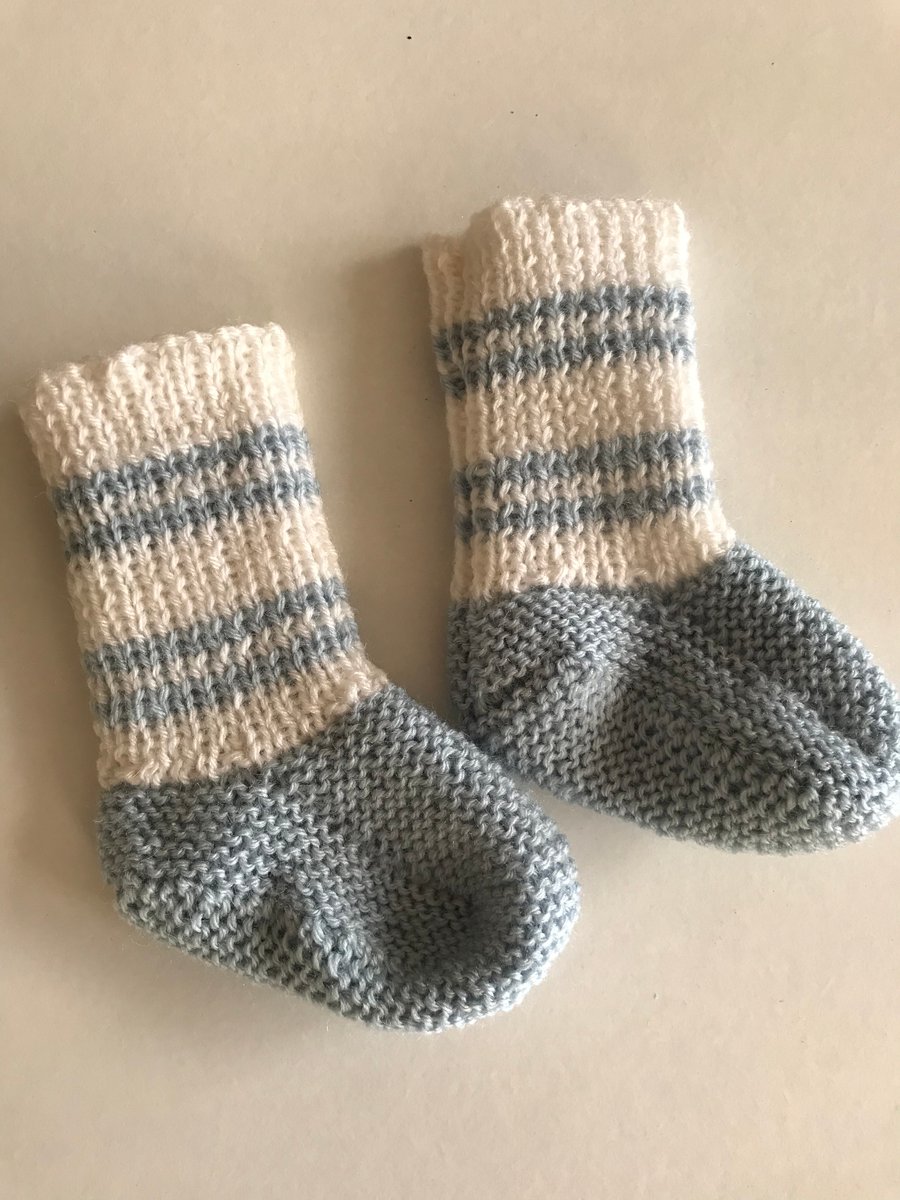 Hand knitted blue and white baby bootees