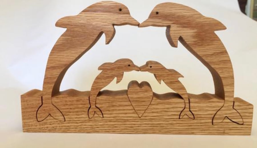Family of four dolphins, dolphin family. Solid wood dolphins lovely present 