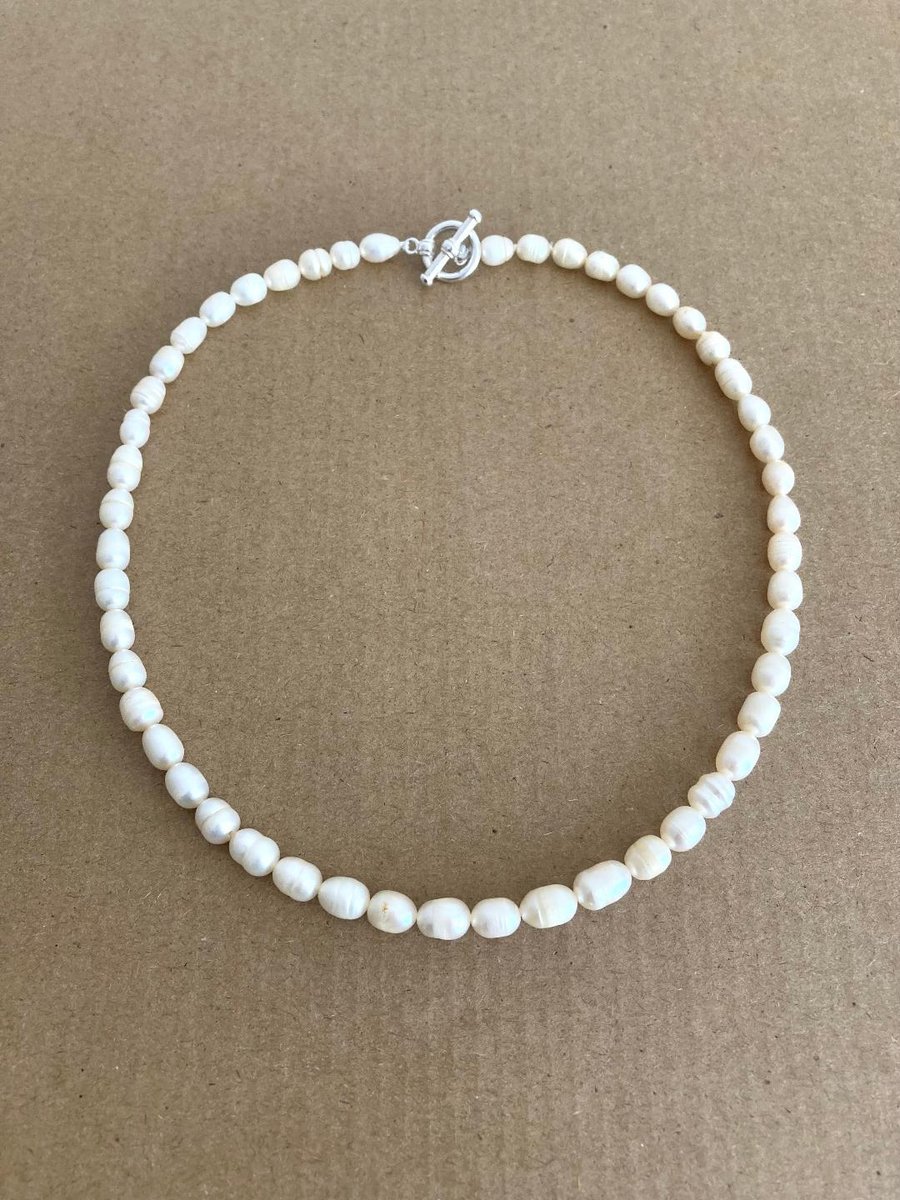 Beautiful Ivory Colour Fresh Water Pearl Oval Shape Hand Knotted Necklace