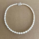 Beautiful Ivory Colour Fresh Water Pearl Oval Shape Hand Knotted Necklace