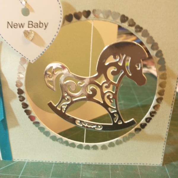 Blue new baby boy rocking horse card