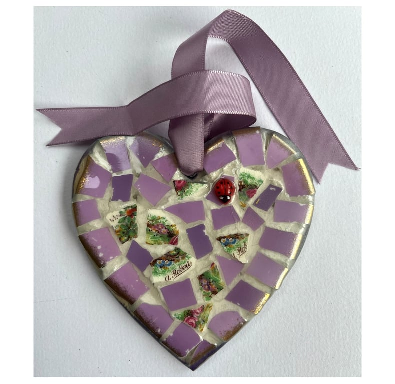 A 'pretty in pink' heart shaped pendant with mauve undertones.
