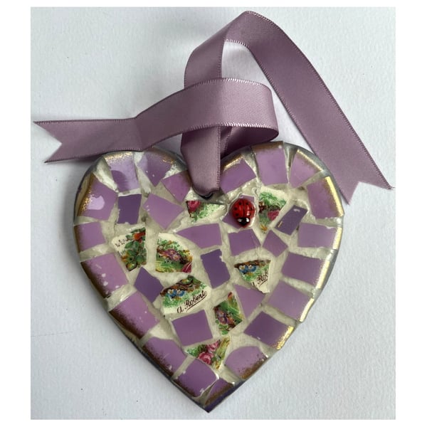 A 'pretty in pink' heart shaped pendant with mauve undertones.