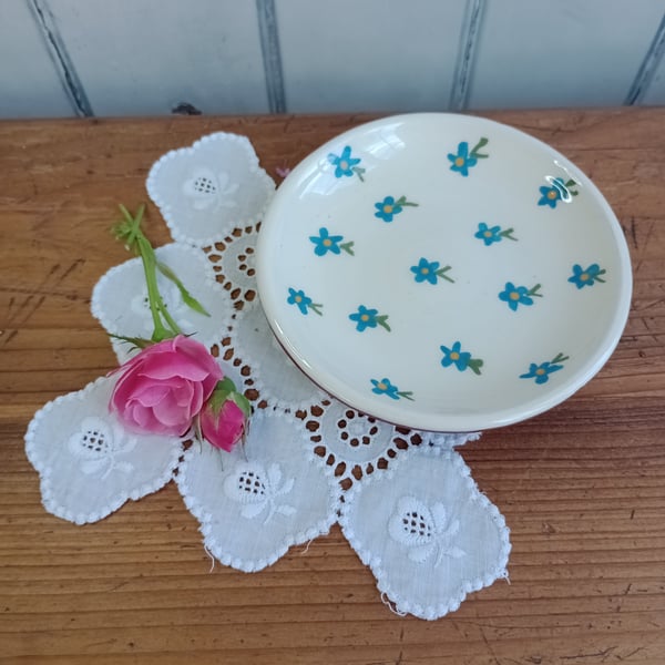 White jewellery dish with blue flower design