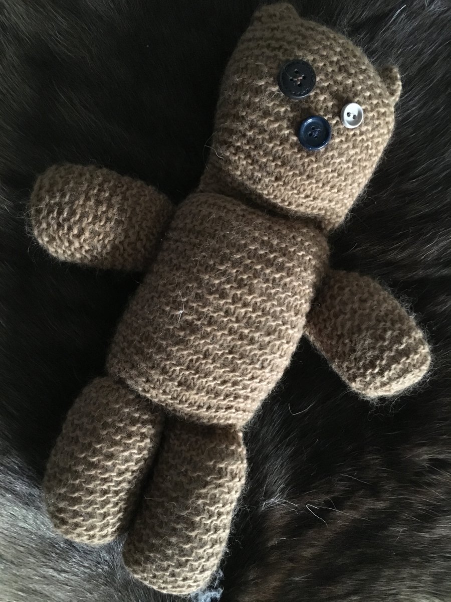Hand knitted button-eye teddy bear