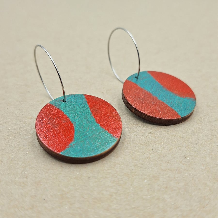Red and green small wooden disc abstract earrings on stainless steel hoops