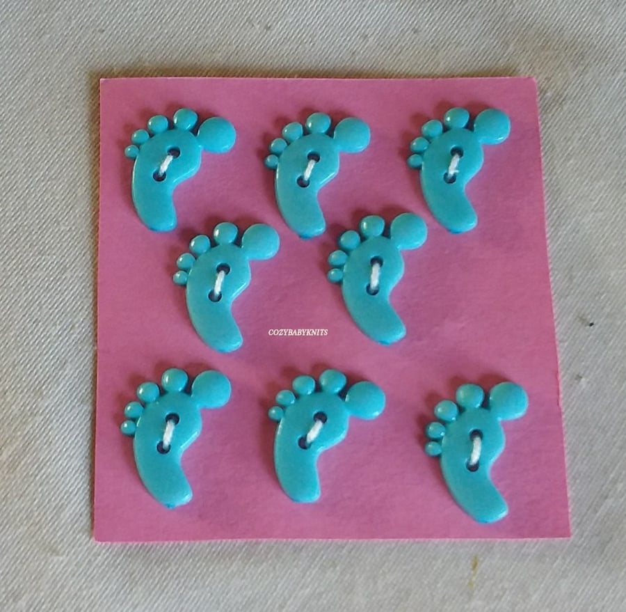 Pale blue feet shaped buttons
