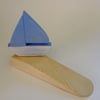 Door wedge with a yatch or boat. Ideal for sailing enthusiasts or mariners. 
