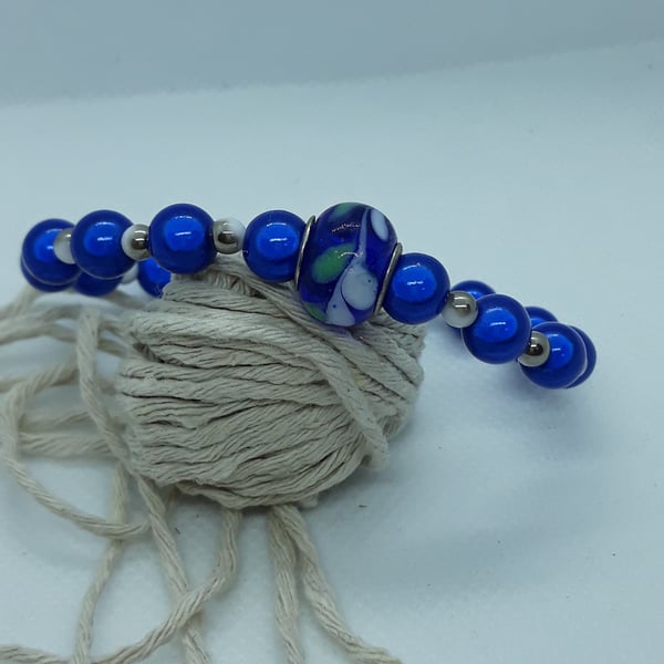 BR371 Blue miracle bead bracelet with glass feature bead