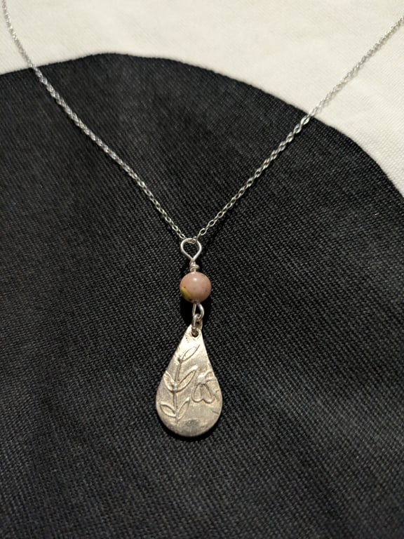 Silver tear drop pendant with flower and leaf pattern
