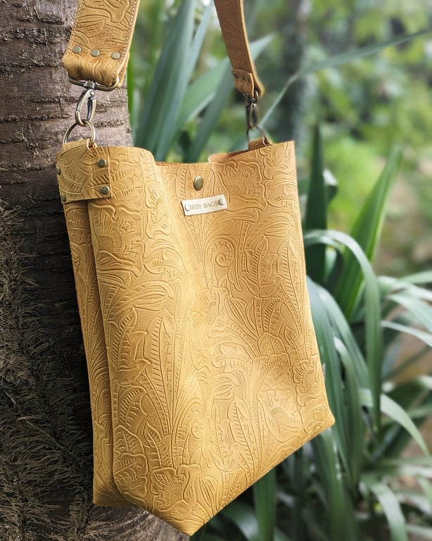 Embossed leather bucket bag