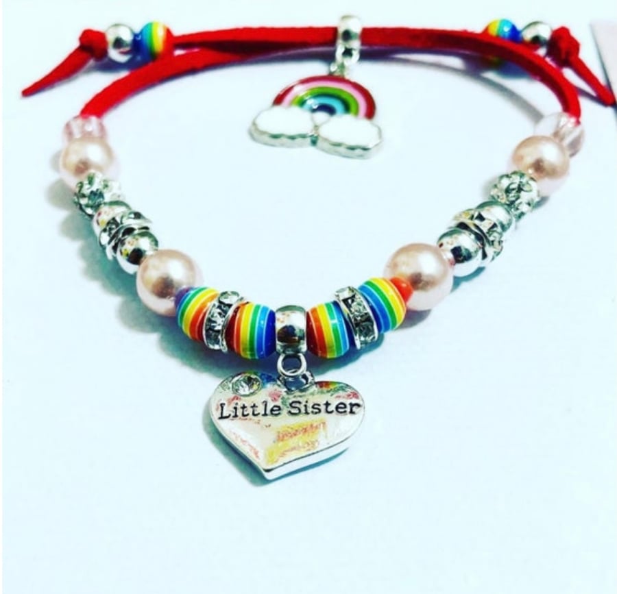 Little sister red suede effect corded bracelet with rainbow charm bracelet 