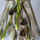 Beautiful WitchBells, hanging from a 6" circle of woven willow 