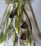 Beautiful WitchBells, hanging from a 6" circle of woven willow 