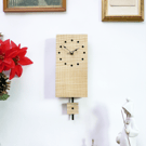 Handmade Wooden Pendulum Wall Clock in ripple sycamore with inlaid ebony dots