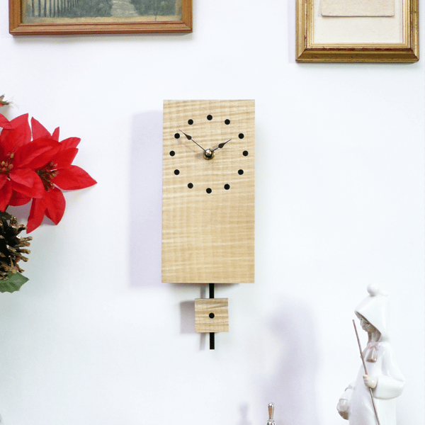 Handmade Wooden Pendulum Wall Clock in ripple sycamore with inlaid ebony dots