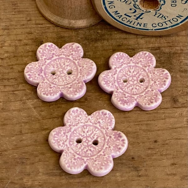 Set of three flower shaped ceramic handmade buttons pink