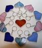 Handmade heart bag charms or keyrings using unique stained glass patterns.