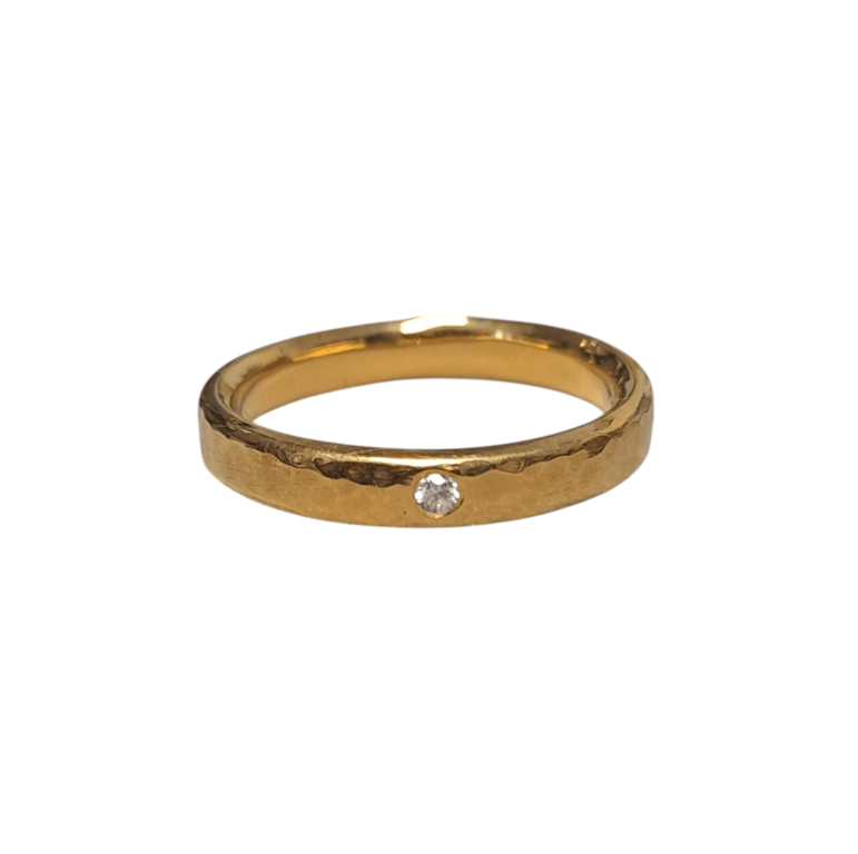 4mm wide hammered ring with diamond 
