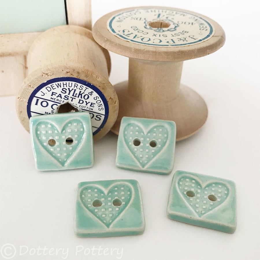 Set of four little rectangular ceramic handmade buttons