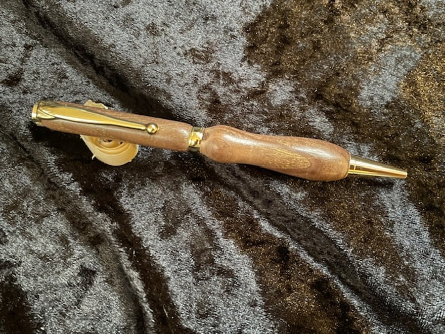Handturned ball pen with gold plated trims