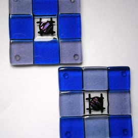 Fused glass coasters in blue and pale lilac