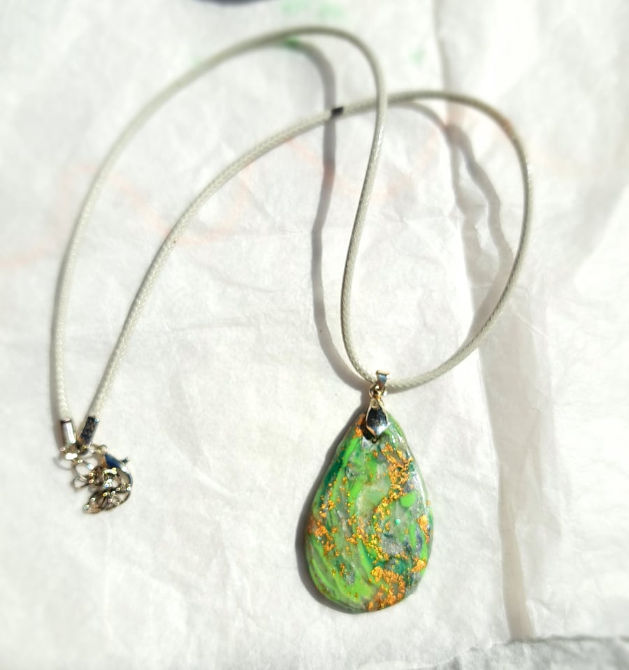 Lovely Oval handmade pendant, green, translucent white, silver and gold leaf