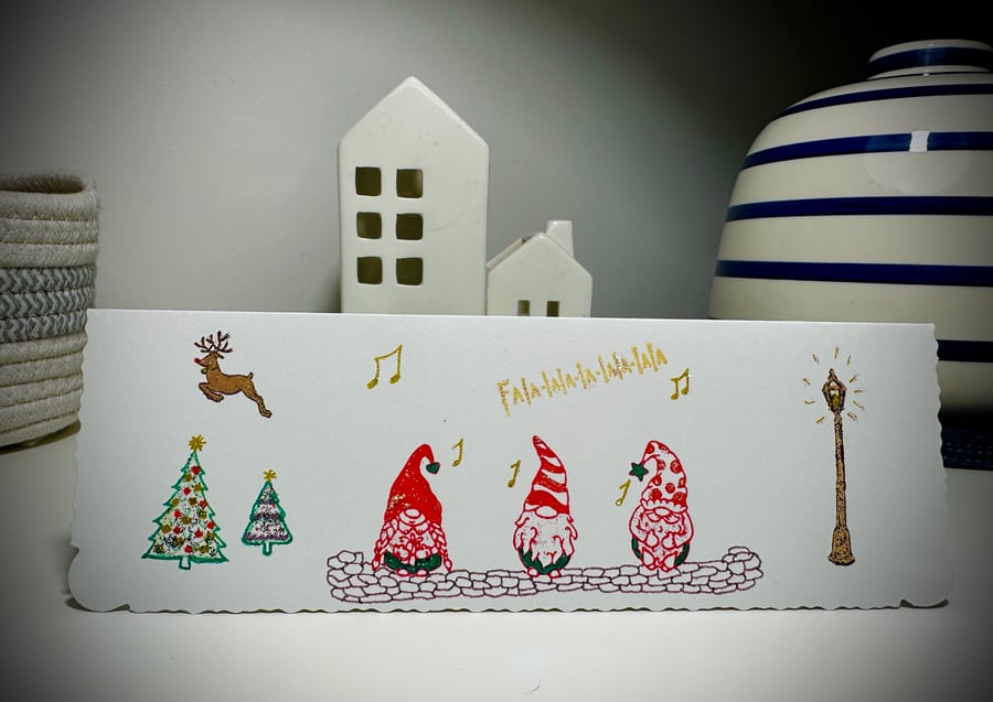 Christmas card with 3 gnomes carol singing, Rudolph, Christmas trees, fa la la 