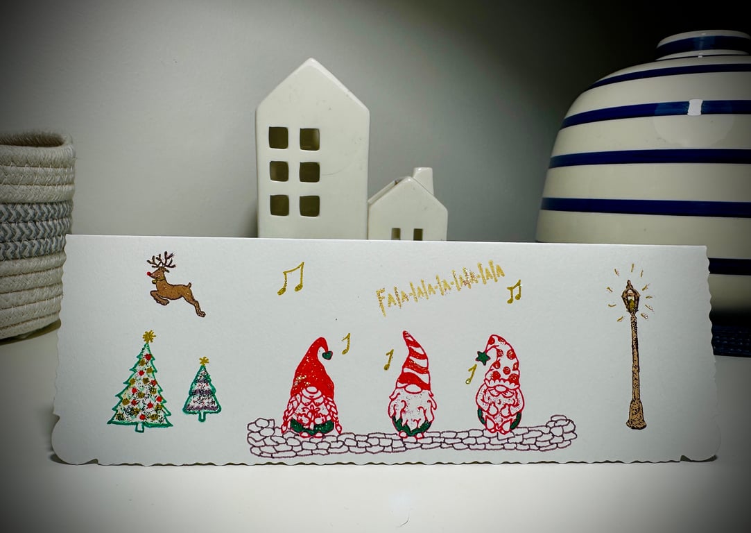 Christmas card with 3 gnomes carol singing, Rudolph, Christmas trees, fa la la 