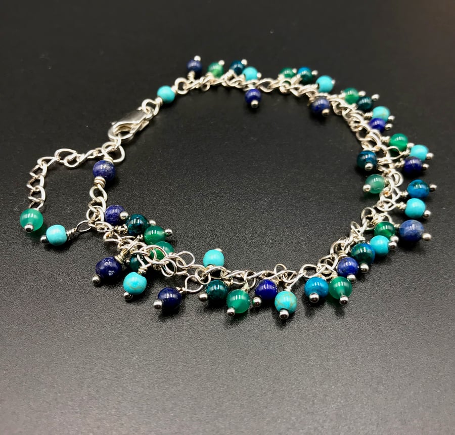 mixed gemstone sea tone silver charm bracelet