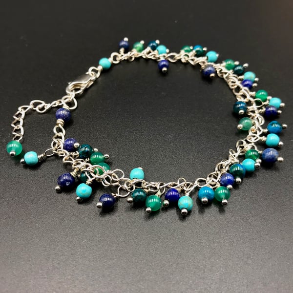 mixed gemstone sea tone  silver charm bracelet