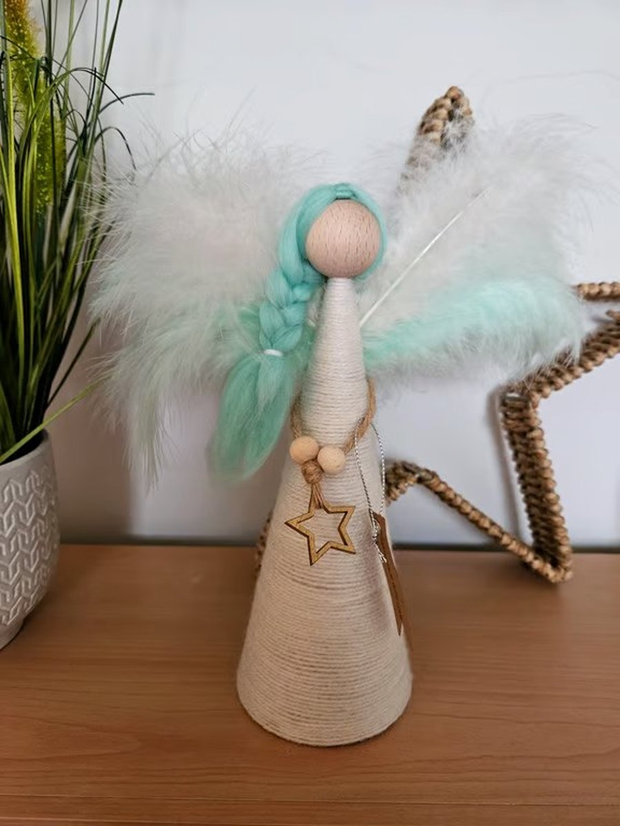 Image of Tree topper angel, green and white wings and green hair