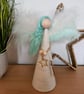 Tree topper angel, green and white wings and green hair