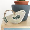 Ceramic bird decoration with patterned wing and tail 