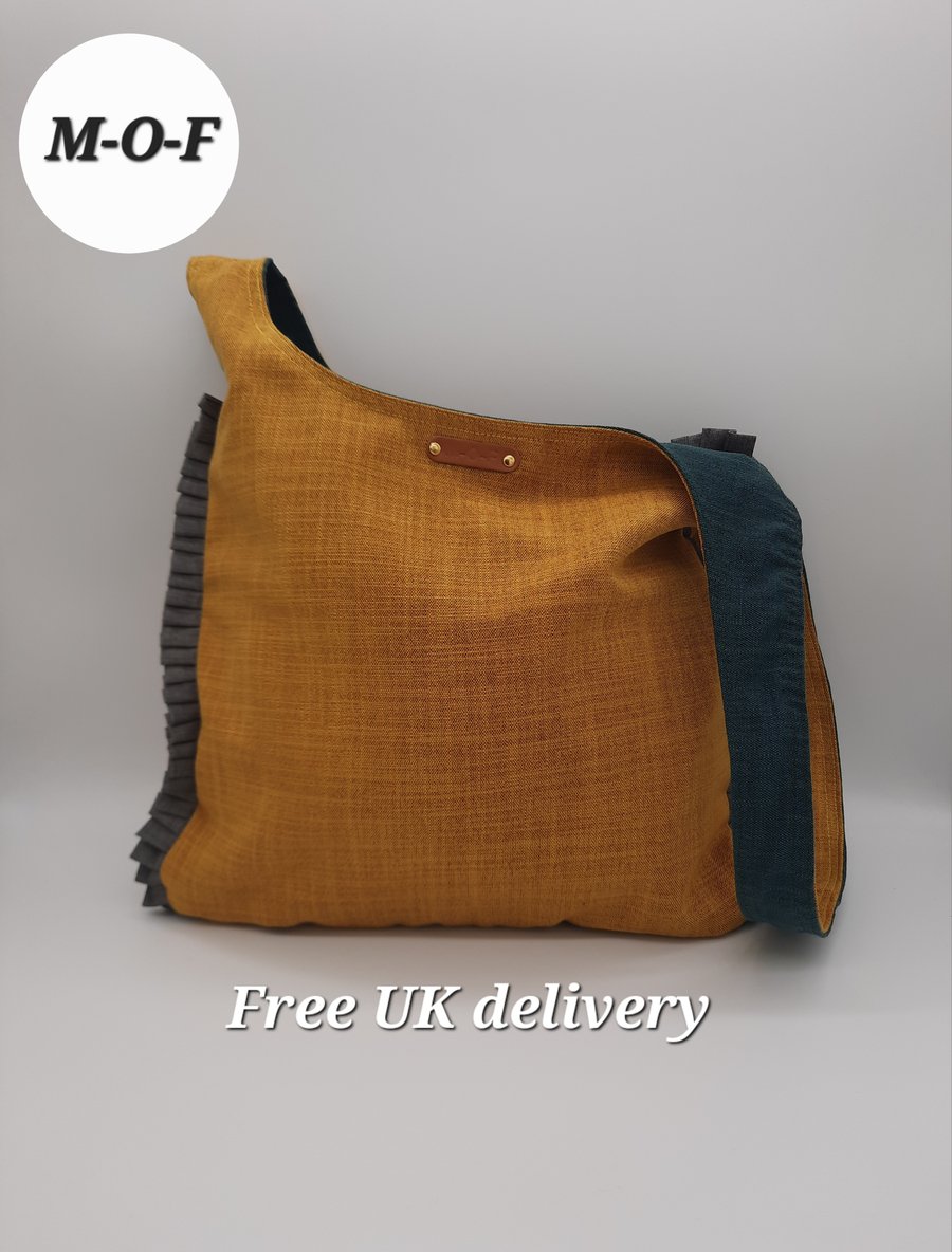 Medium reversible yellow and green knot bag. 