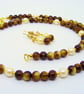 Small bead golden brown glass and pearl necklace earring set