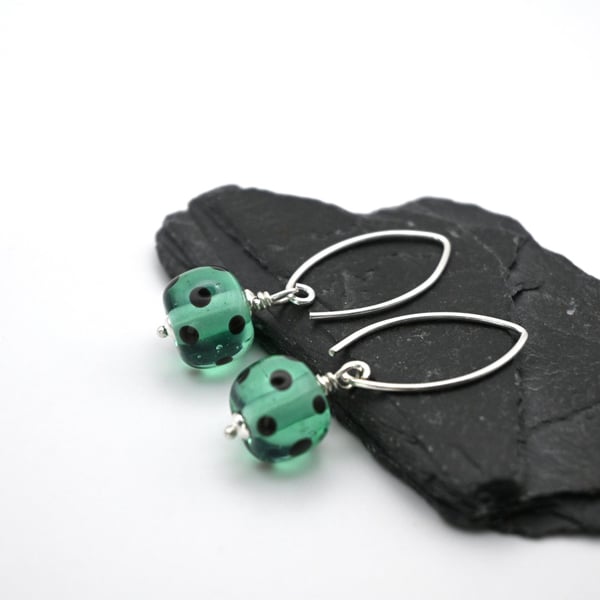 green and black polka dot lampwork glass earrings