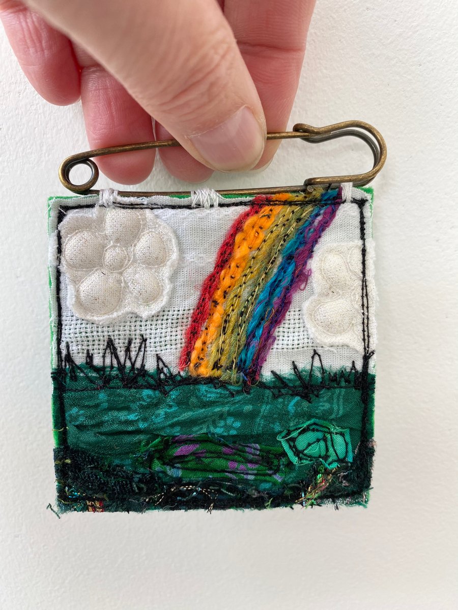 Embroidered up-cycled rainbow landscape brooch kilt pin. 