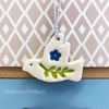 Teeny ceramic dove decoration with leaves and blue flower