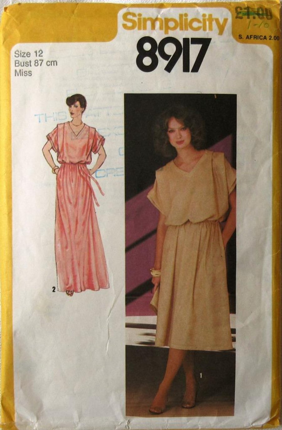 A sewing pattern for a misses' pullover dress in 2 lengths in size 12 