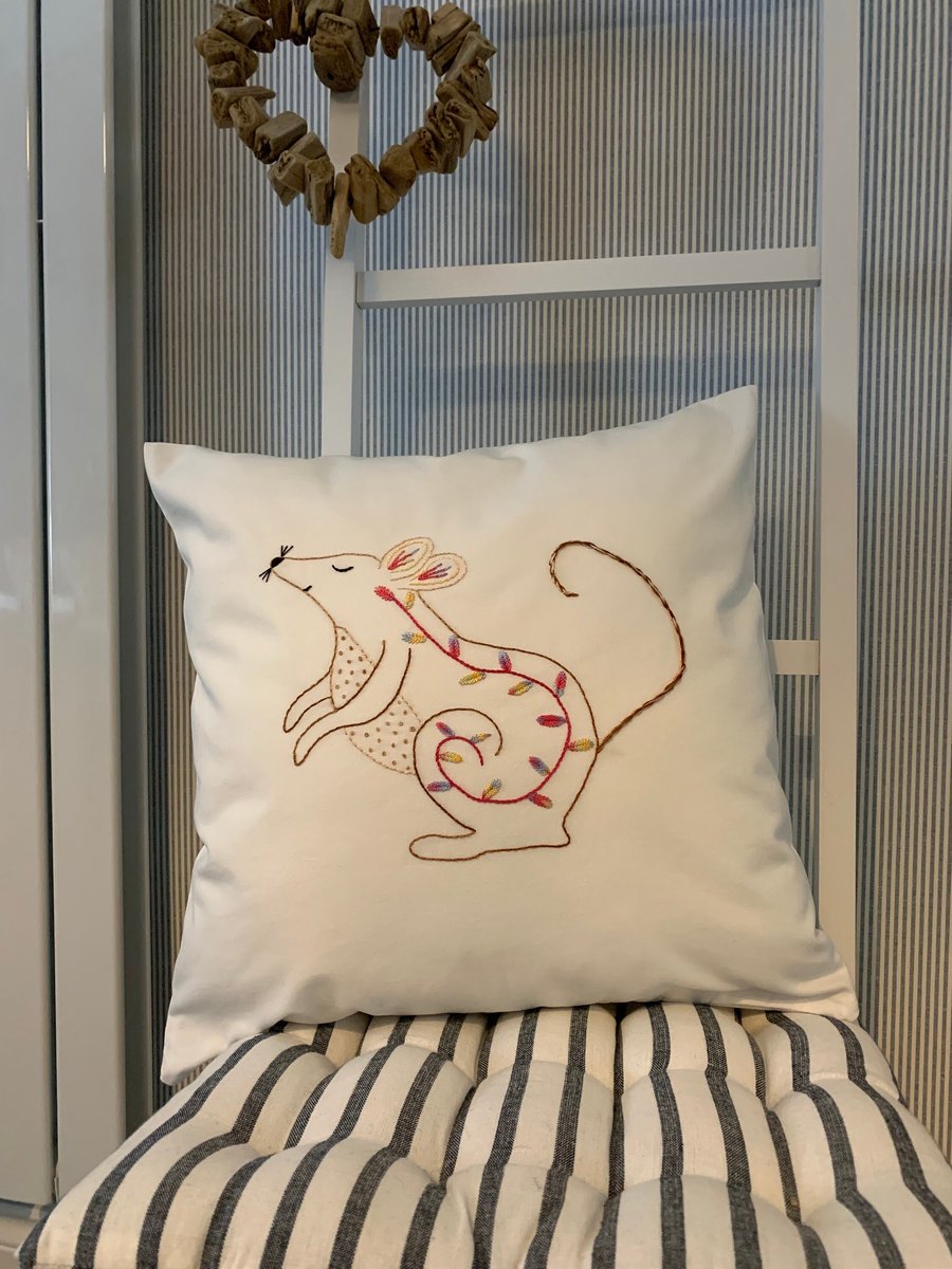 Large white cushion cover embroidered with a Multi coloured floral mouse design 